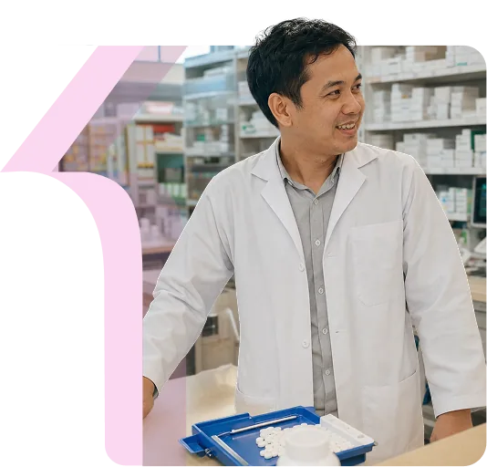A pharmacist reviewing stock in a hospital dispensary