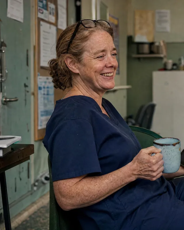 A nurse on a hospital break, reading on a tablet