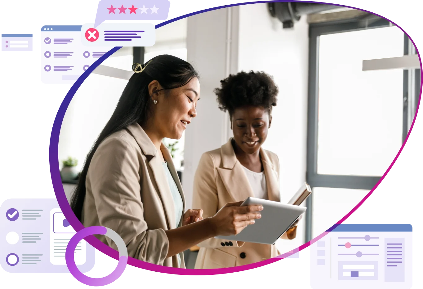 Photo of two women working on a tablet at an office