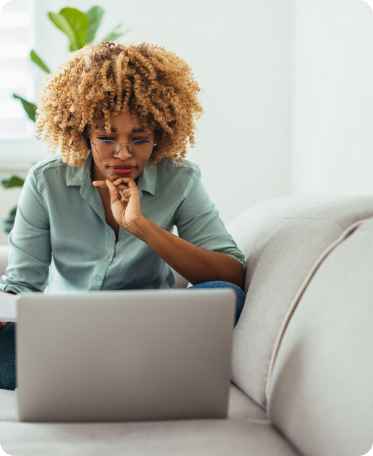 Photo of a woman working on a laptop